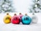 Beautiful shiny round multicolored Christmas balls on a white snow background