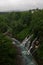 Beautiful Shirogane Falls dropping into a blue river