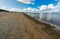 Beautiful shoreline of big sandy beach and Baltic sea at cloudy and windy day catched at long