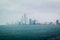 Beautiful shot of Abu Dhabi city skyline towers and beach on a cloudy day