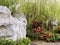 Beautiful shot of big boulders surrounded by vegetation in a garden