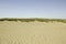 Beautiful shot of the  Black Rock Sands Beach with a blue sky in the background in Porthmadog