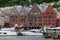 Beautiful shot of boats and the facades of the historical buildings in Bergen, Norway