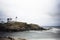 Beautiful shot of the Cape Neddick Lighthouse in York, Maine under a gloomy sky