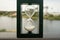 Beautiful shot of a classic vintage Hourglass or Sandglass Clock with nature in the background