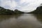 Beautiful shot of colombian palomino river in middle of guajira vegetation with mountains