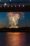 Beautiful shot of colorful fireworks behind The Benjamin Franklin Bridge