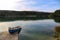 Beautiful shot of a fishing boat in Walchensee lake, Bavaria, Germany.