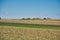 Beautiful shot of hayfield under a blue sky