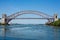 Beautiful shot of Hell Gate Bridge in New York under a blue sky