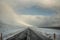 Beautiful shot of a highway in Iceland covered with snow during a tempest under the cloudy sky