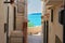 Beautiful shot of a historical narrow street with a view of the sea in Vieste, Italy