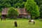 Beautiful shot of horses around a small ranch on a spring day