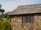 Beautiful shot of a house made of uneven bricks during midday