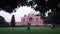 Beautiful shot of the Humayun\'s tomb in India surrounded by a garden and visitors