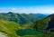 Beautiful shot of Lake Capra in the Fagaras Mountains on a bright day in Romania