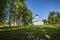 Beautiful shot of monastery near trees under a blue sky in the city of Alexandrov at Russia