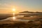 Beautiful shot of a mouth of a small river on the beach at sunset