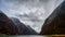 Beautiful shot of Naeroyfjord mountains under a cloudy sky in Norway