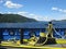 Beautiful shot of a new ship deck with yellow ropes sailing in a mountain lake in Quebec, Canada