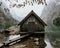 Beautiful shot of Obersee Lake Boat House against mountains in Germany