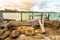 Beautiful shot of an old weathered pier by the sea at sunset