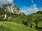 Beautiful shot of the parish church in the small village of Purgg and Grimming peak, Styria, Austria