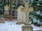 Beautiful shot of a part of a cemetery with tombstones of different shapes and sizes in winter