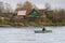 Beautiful shot of a person sailing a boat in the White S ea on cloudy weather in autumn