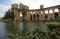 Beautiful shot of pillars near a lake on a thin cloud background