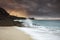 Beautiful shot of Porthcurno, Cornwall at a beachside on a cloudy dawn