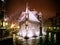 Beautiful shot of rain over a building looking straight out of a fairytale in the middle