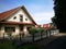 Beautiful shot of red-roofed house surrounded with trees