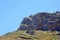 Beautiful shot of rocks in summer under the bright pure sky - perfect for an article about hiking