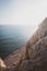 Beautiful shot of rocky cliffs over the water near Pissouri trail, Cape Aspro, Pissouri, Cyprus