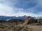 Beautiful shot of rounded rocks of Alabama hills and the arid plains with dry bushes