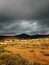 Beautiful shot of sandy dry lands before the storm in Corralejo Natural Park, Spain