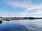 Beautiful shot of ships at the harbor under a blue cloudy sky in Norway