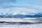 Beautiful shot of snowy field and mountains in the distance in the north of Sweden