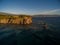 Beautiful shot of the sun rising over the beach on a breezy autumn day in Lesbos, Greece