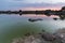 Beautiful shot of a sunset over a pond in Barruecos, Spain