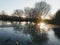 Beautiful shot of a sunset view,  ducks swimming in the lake