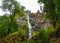 Beautiful shot of a tiny waterfall  in the green mountains of Oregon - [erfect for a travel blog