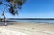 Beautiful shot of a tranquil wild sandy beach, picturesque seascape in the background