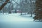 Beautiful shot of trees, ground, and houses covered with white snow during winter