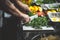 Beautiful shot of an unrecognizable chef preparing food on a cutting board for a massive party