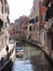 Beautiful shot of a Venice Canal with Renaissance buildings and gondola