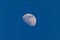 Beautiful shot of the waxing gibbous Moon in blue sky