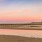 Beautiful shot of wispy clouds adorning the Long Jetty at sunrise, Port Welshpool