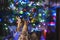 Beautiful shot of a wooden handmade horse on the blurred Christmas tree  background